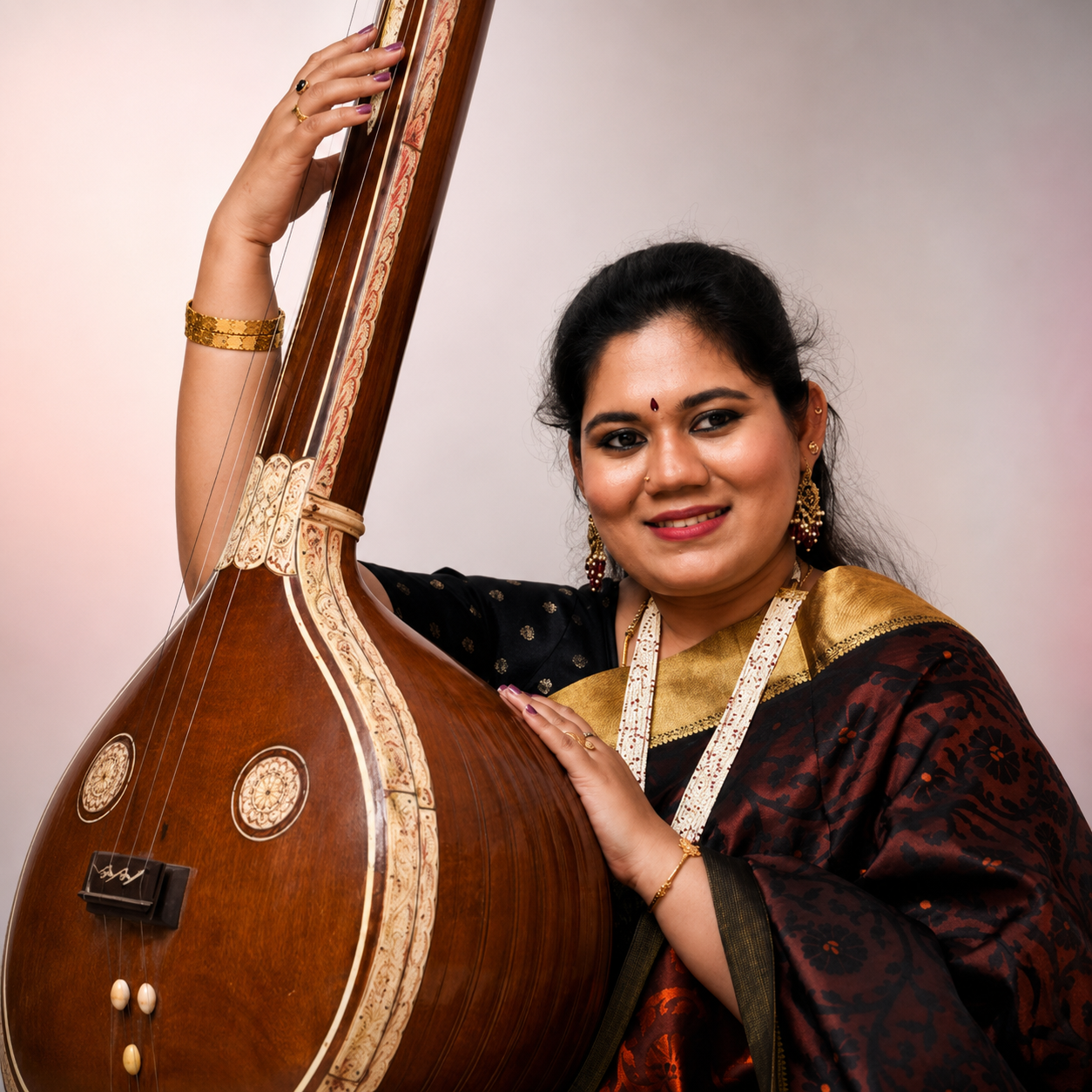 Divya Meena Guhan, Founder and Director, playing the veena